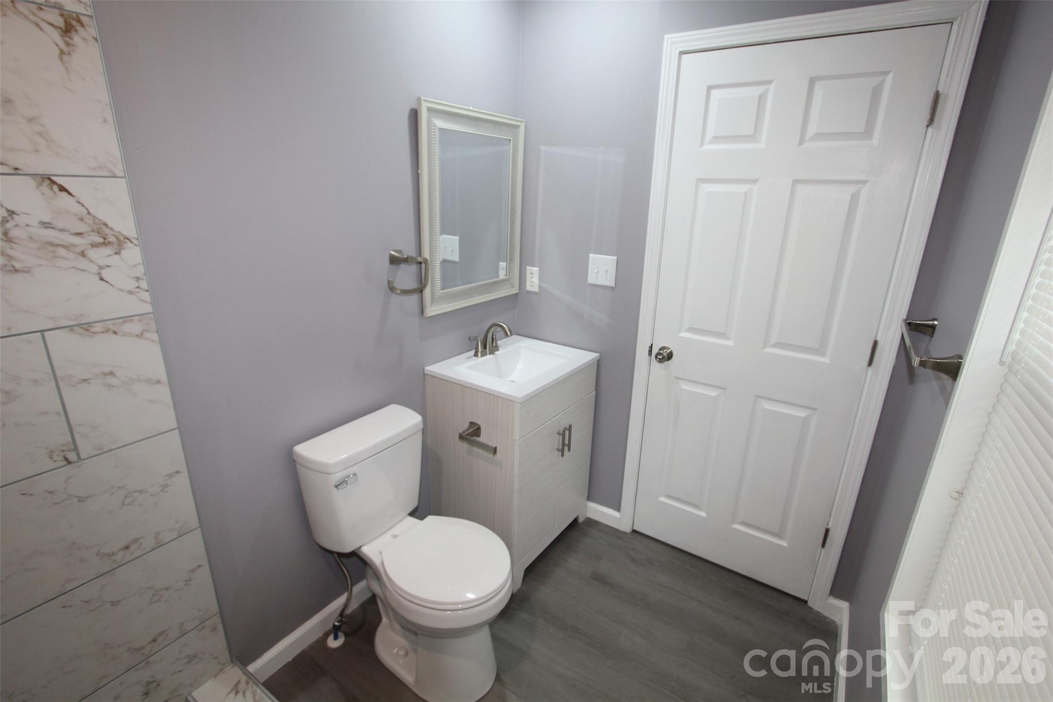 48 Piper Road Wadesboro, NC 28170 - Photo 21 of 34 a white toilet sitting next to a sink