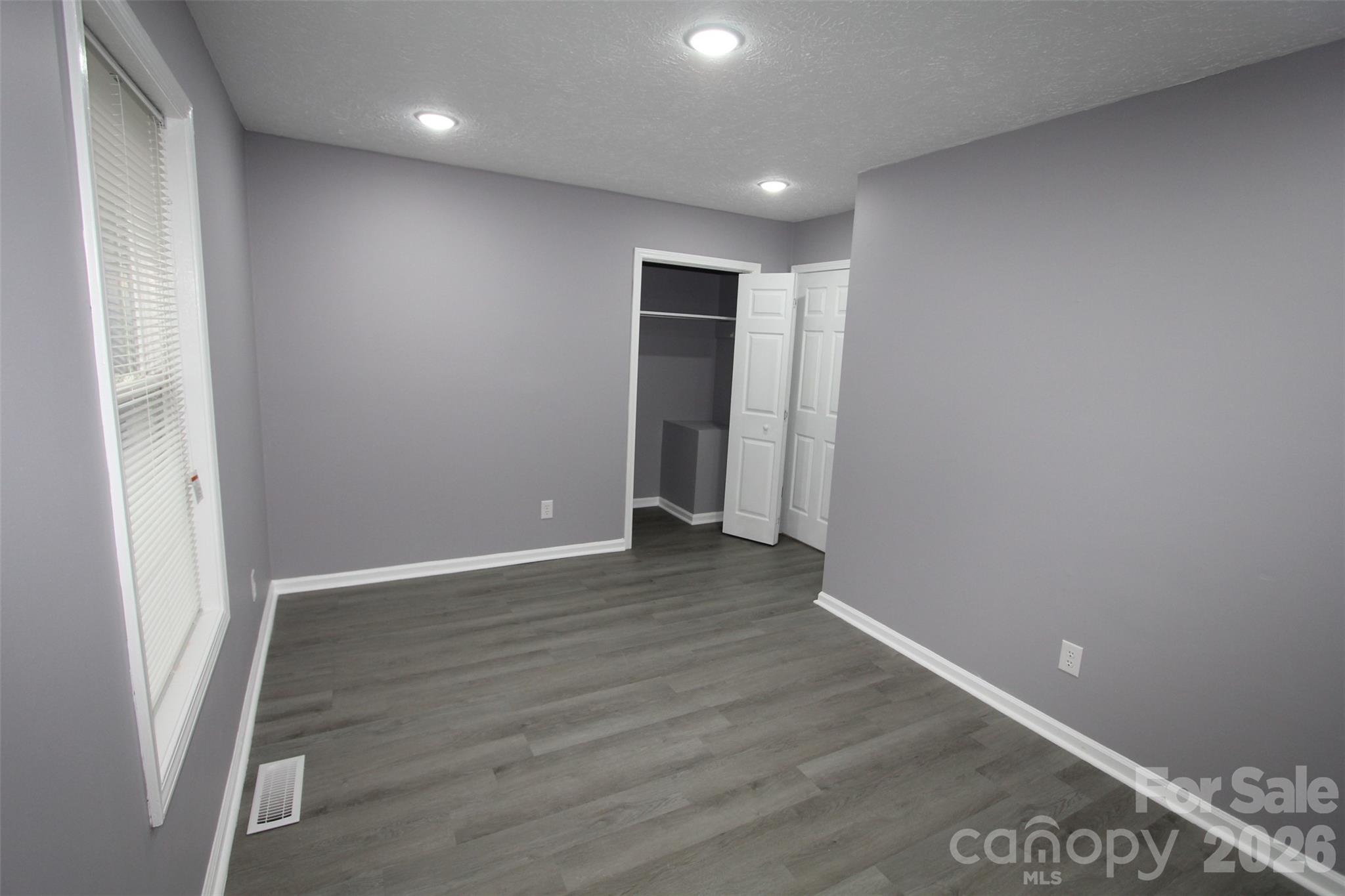48 Piper Road Wadesboro, NC 28170 - Photo 25 of 34 an empty room with wooden floor and closet