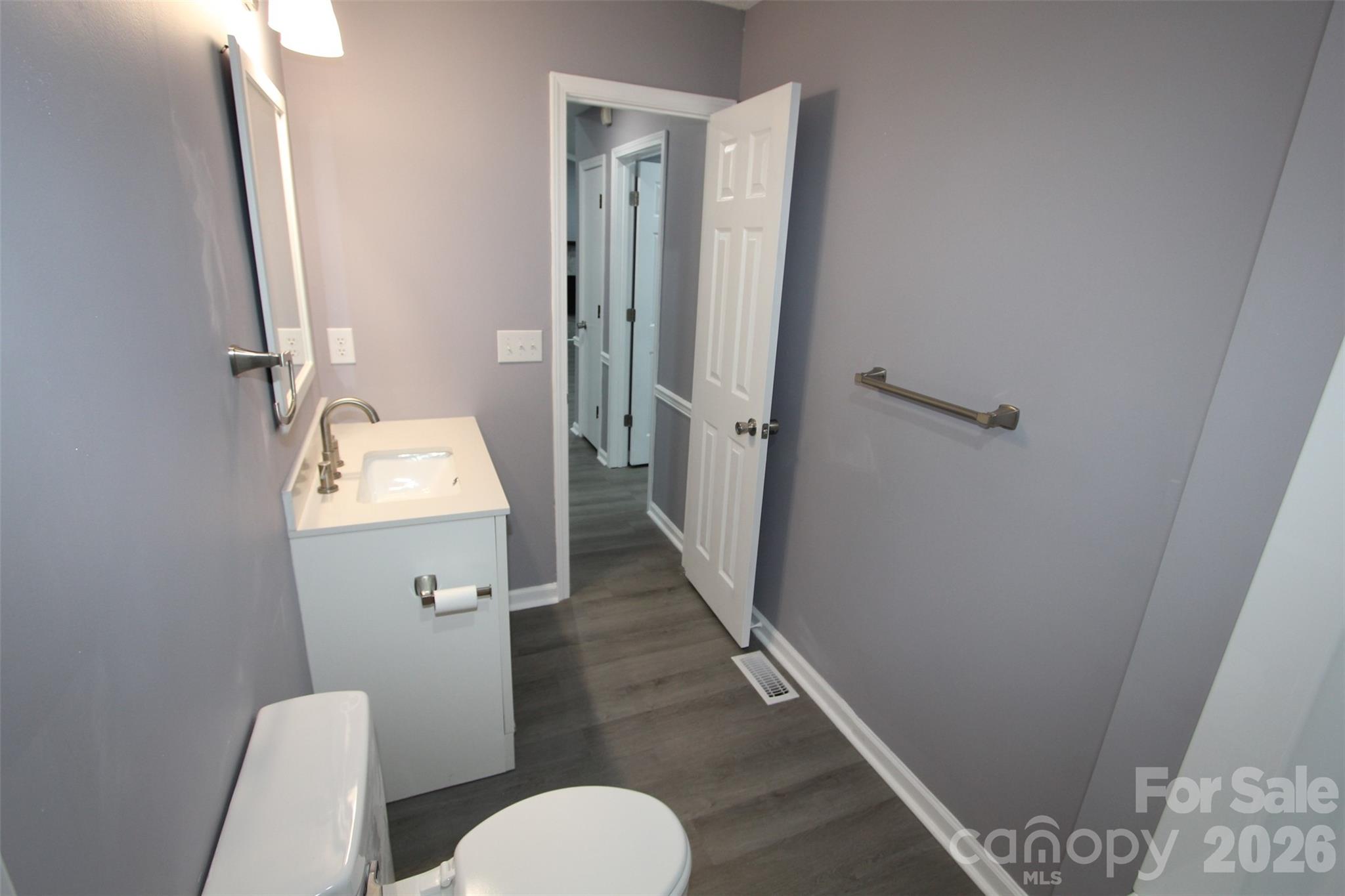 48 Piper Road Wadesboro, NC 28170 - Photo 28 of 34 a bathroom with a sink a toilet a mirror and shower