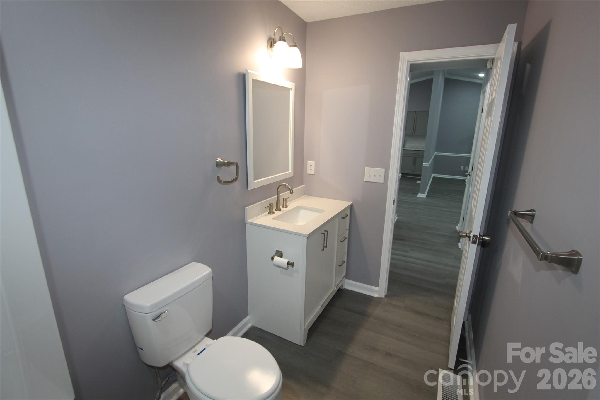 48 Piper Road Wadesboro, NC 28170 - Photo 29 of 34 a bathroom with a toilet sink and mirror