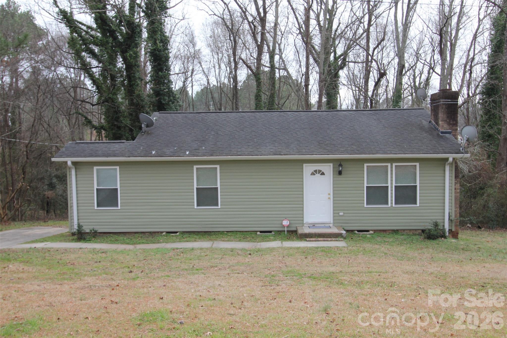 48 Piper Road Wadesboro, NC 28170 - Photo 30 of 34 a front view of a house with a garden