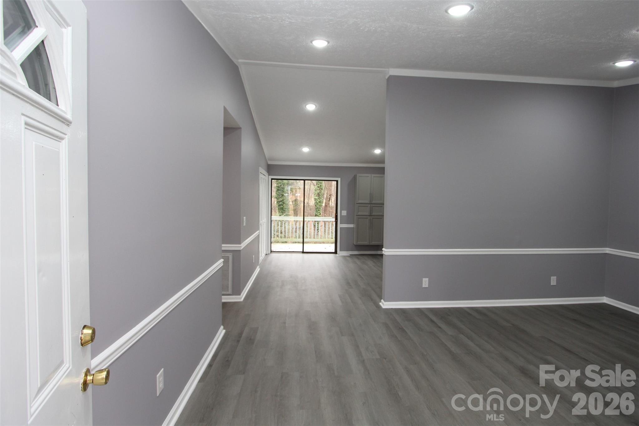 48 Piper Road Wadesboro, NC 28170 - Photo 4 of 34 a view of an empty room with wooden floor and a window