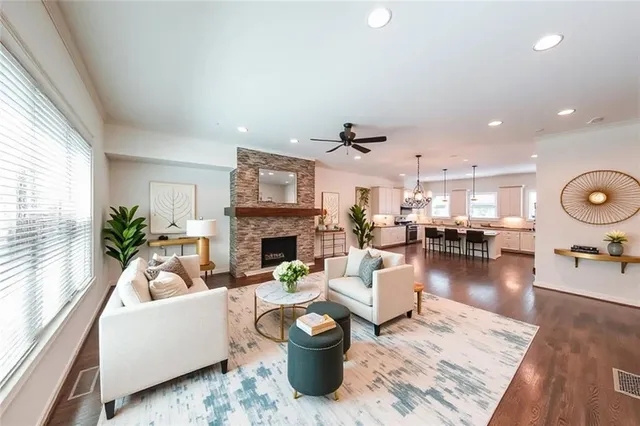 a living room with furniture and a fireplace