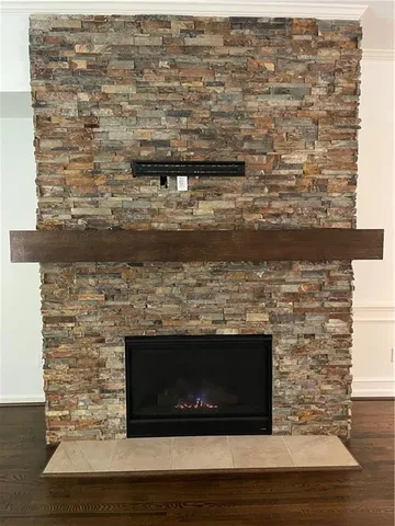 a view of fireplace with wooden floor