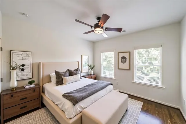 a bedroom with a large bed and a window