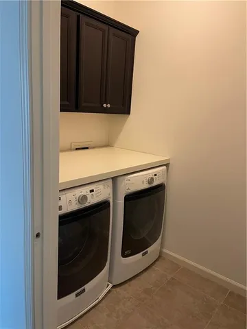 a stove top oven sitting inside of a kitchen