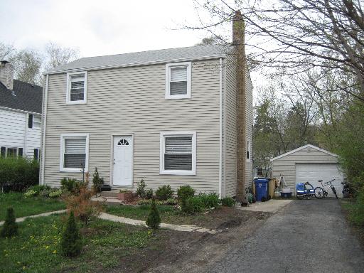 402 North Main Street Mount Prospect, IL 60056 - Photo 1 of 1 a front view of a house with a yard and garage