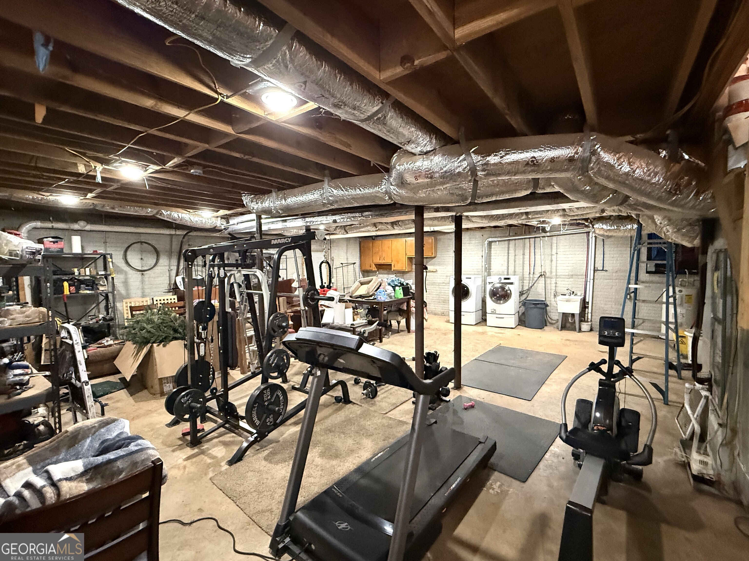 725 Musgrove Road Griffin, GA 30223 - Photo 50 of 52 a view of a room with gym equipment
