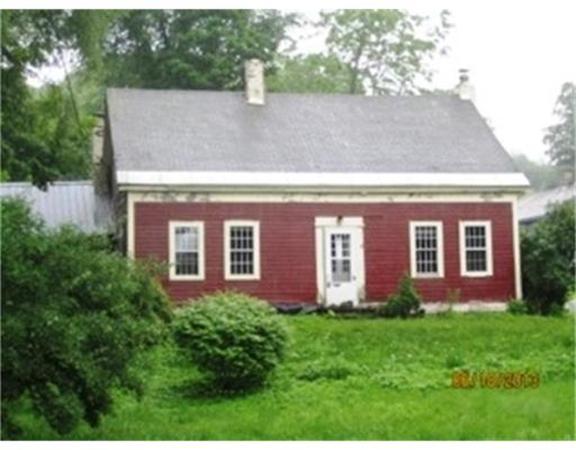 3 Bates Road Cummington, MA 01026 - Photo 1 of 15 a view of a house with brick walls and a yard with plants