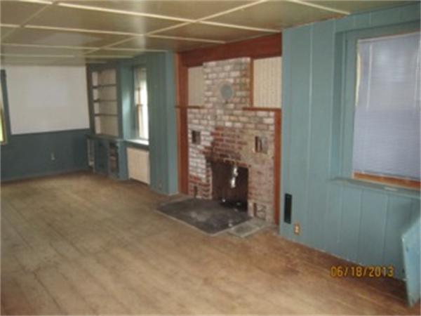 3 Bates Road Cummington, MA 01026 - Photo 12 of 15 an empty room with fireplace and a window