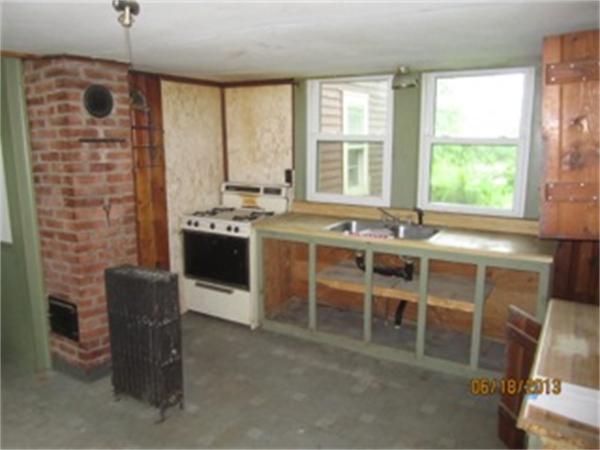 3 Bates Road Cummington, MA 01026 - Photo 7 of 15 a kitchen with a stove a sink and a refrigerator