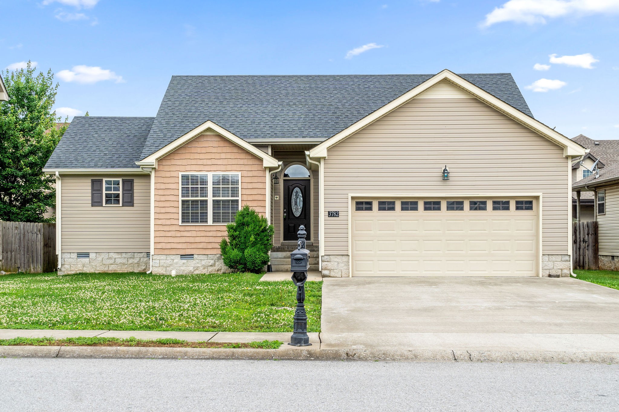 3782 Suiter Road Clarksville, TN 37040 - Photo 1 of 32 a front view of a house with a yard and garage