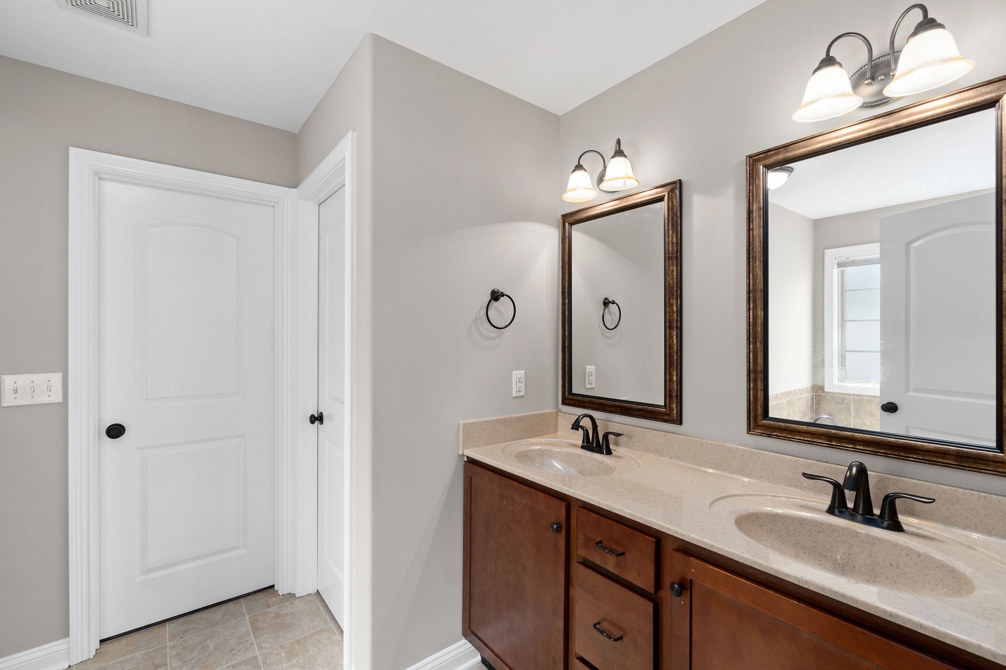 3782 Suiter Road Clarksville, TN 37040 - Photo 22 of 32 a bathroom with a double vanity sink and a mirror