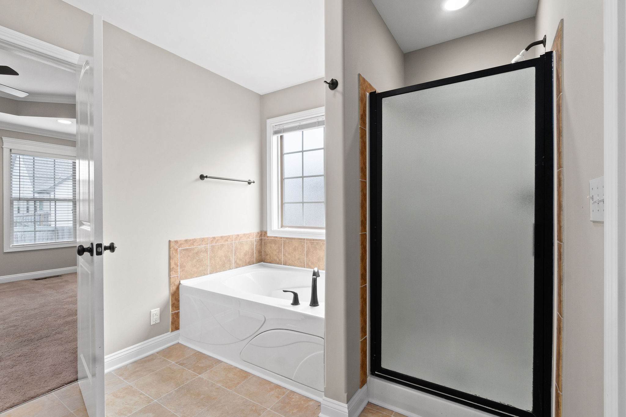 3782 Suiter Road Clarksville, TN 37040 - Photo 24 of 32 a bathroom with a bathtub and a shower