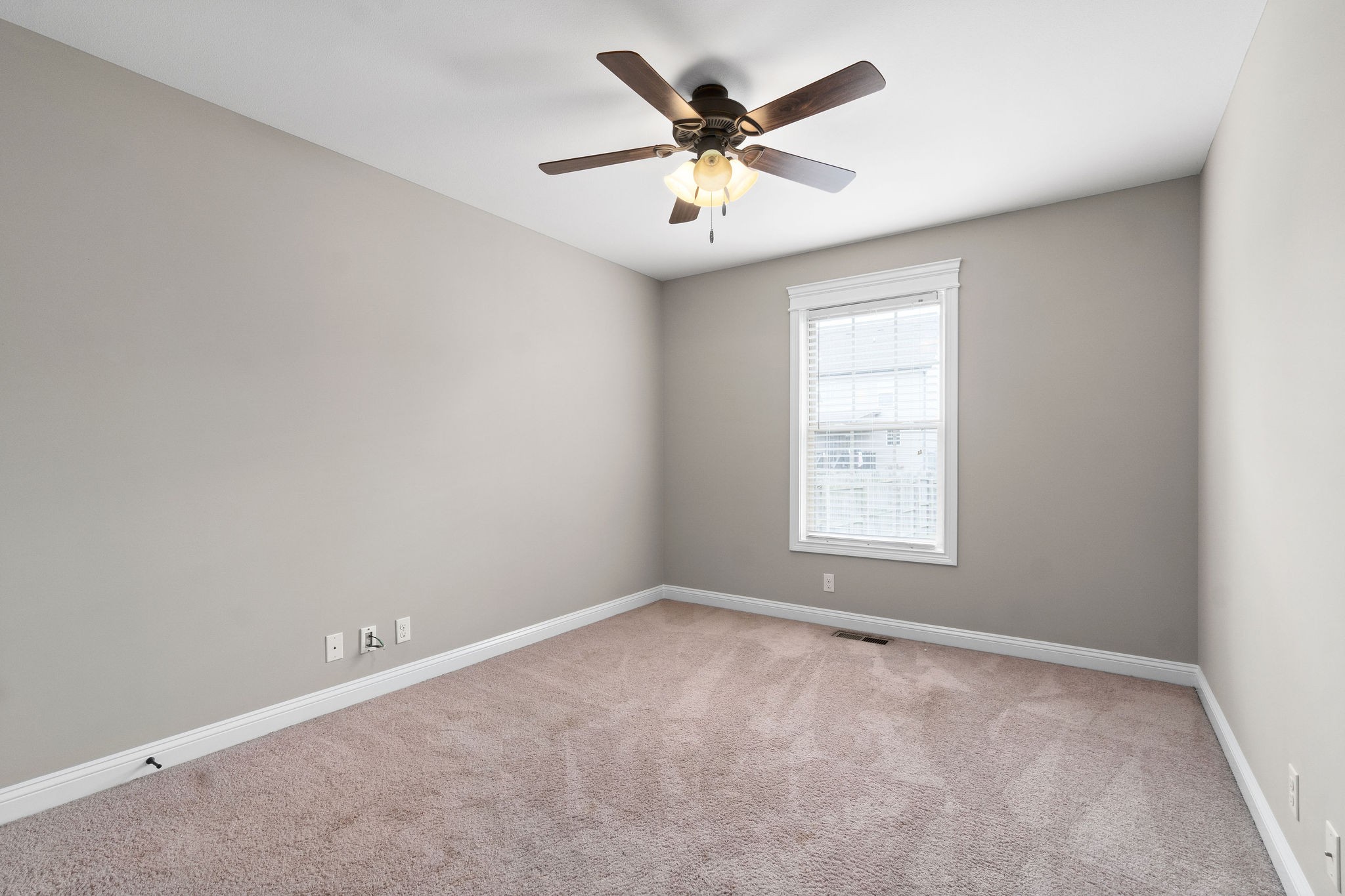 3782 Suiter Road Clarksville, TN 37040 - Photo 26 of 32 an empty room with chandelier fan and windows