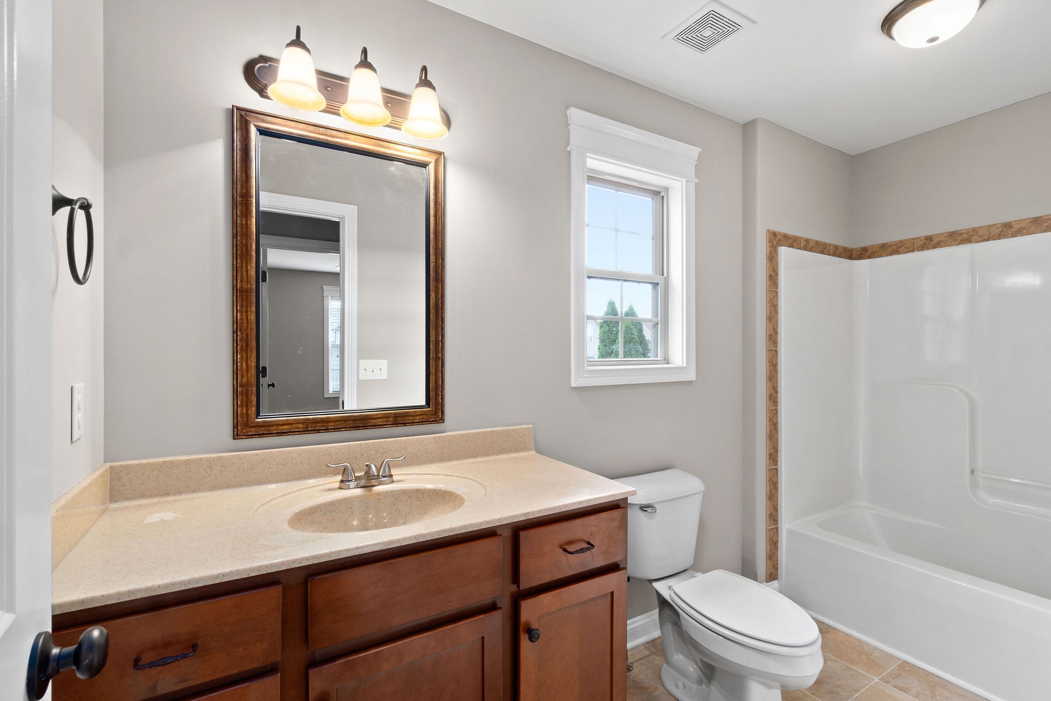 3782 Suiter Road Clarksville, TN 37040 - Photo 27 of 32 a bathroom with a sink toilet a mirror and shower