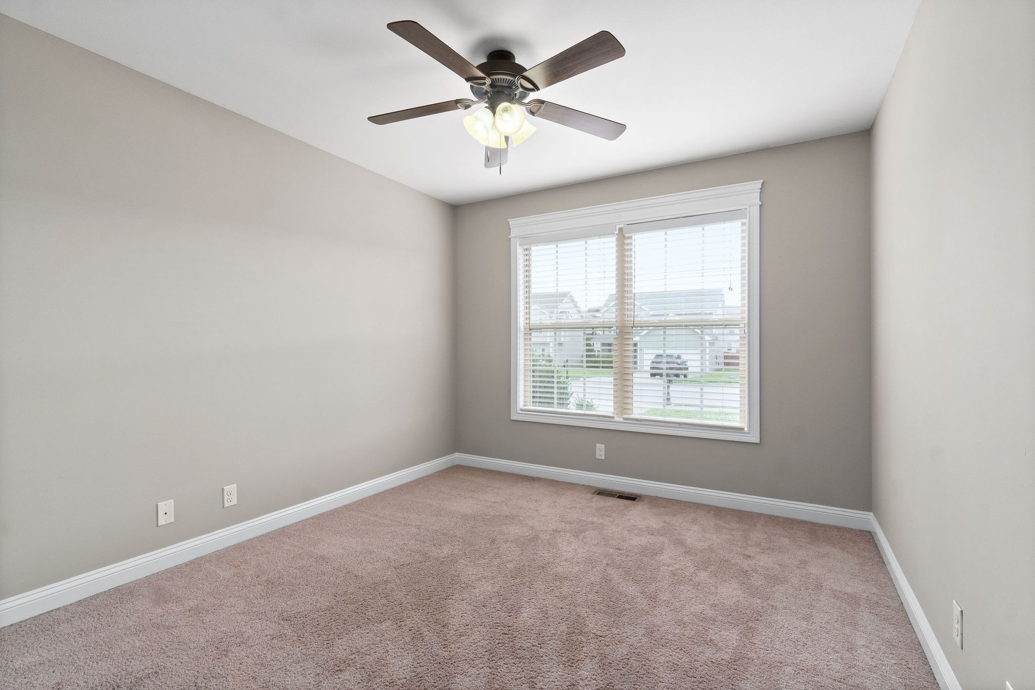 3782 Suiter Road Clarksville, TN 37040 - Photo 28 of 32 an empty room with windows and ceiling fan