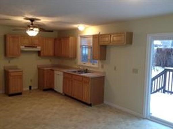 660 Boston Road, Unit 1 Springfield, MA 01119 - Photo 7 of 8 a kitchen with granite countertop a sink cabinets and stainless steel appliances