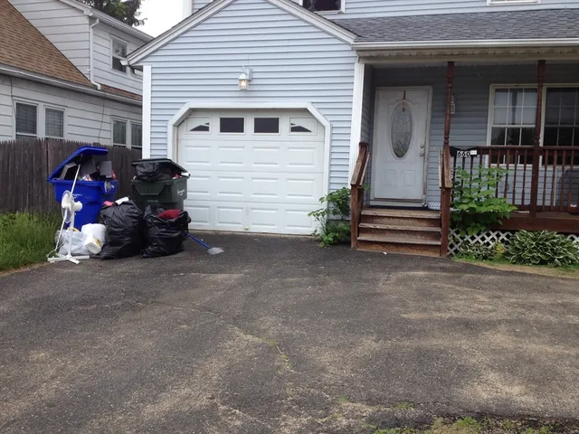 a view of a car park in front of house