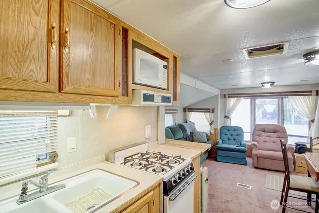 a bedroom with furniture and a window