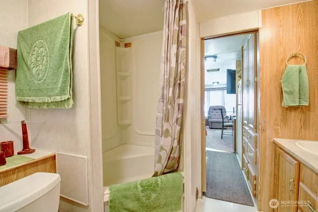 a bathroom with a tub and shower