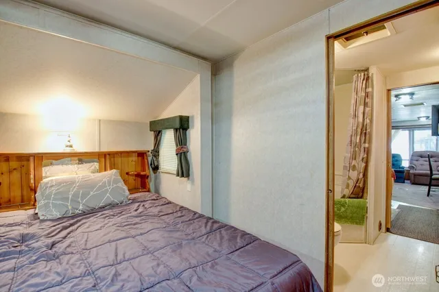 a bedroom with a bed and a walk in closet