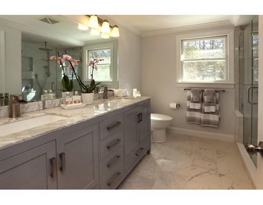 8 Adeline Road Ipswich, MA 01938 - Photo 20 of 28 a bathroom with a double vanity sink a toilet and a window