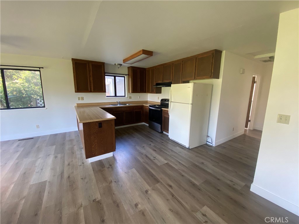 19742 Oak Flat Road Hidden Valley Lake, CA 95467 - Photo 4 of 19 Kitchen open to dining and living areas.