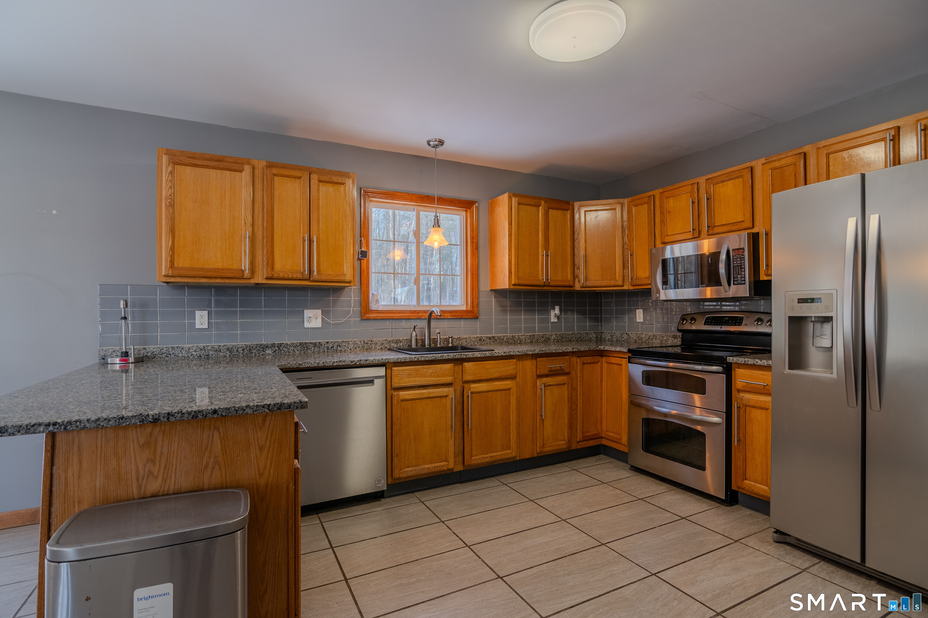 8 Juniper Lane Plainfield, CT 06354 - Photo 11 of 37 a kitchen with stainless steel appliances granite countertop a stove a sink dishwasher a refrigerator and a microwave oven