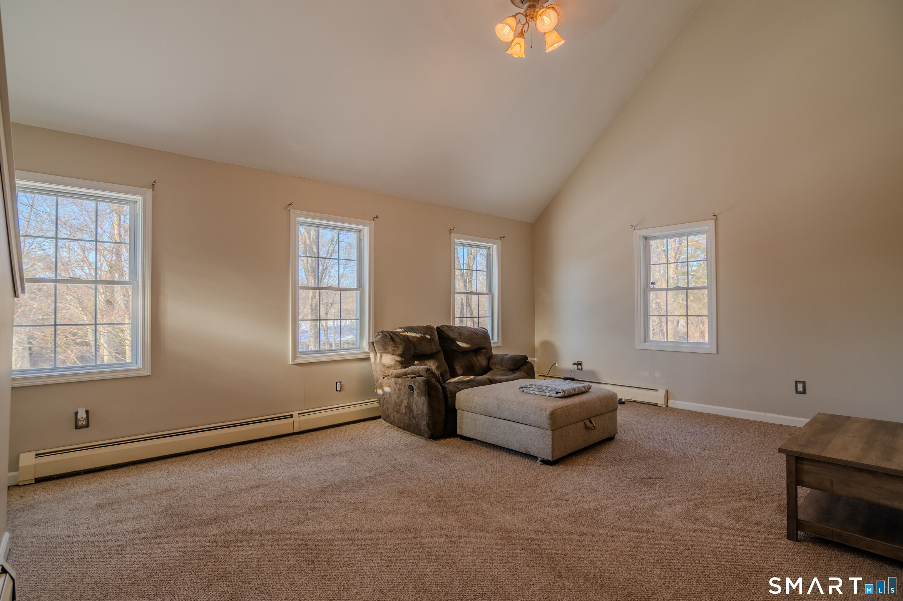 8 Juniper Lane Plainfield, CT 06354 - Photo 17 of 37 a living room with furniture and a window
