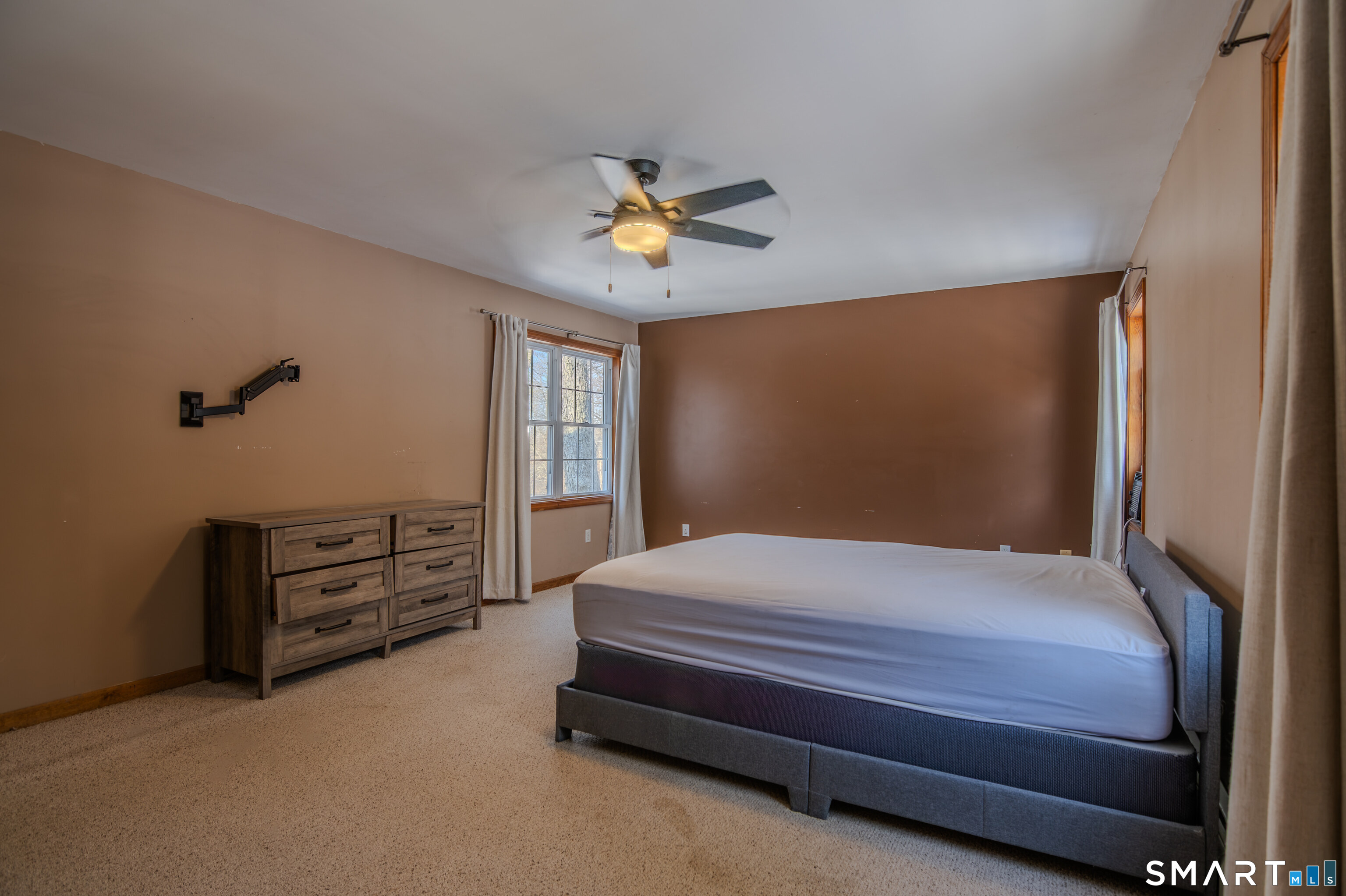 8 Juniper Lane Plainfield, CT 06354 - Photo 24 of 37 a bedroom with a bed and a chandelier
