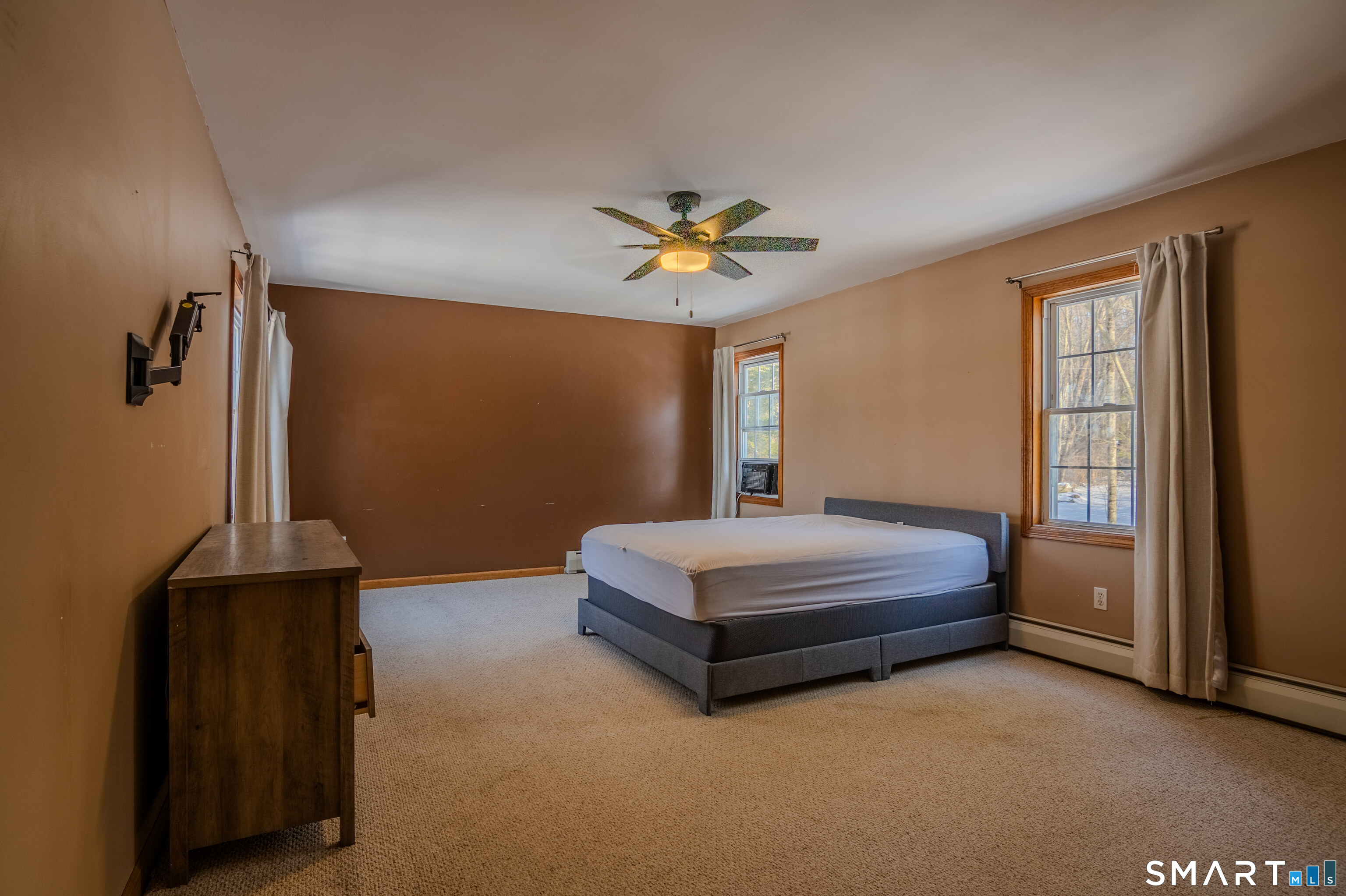 8 Juniper Lane Plainfield, CT 06354 - Photo 25 of 37 a spacious bedroom with a bed and a chandelier