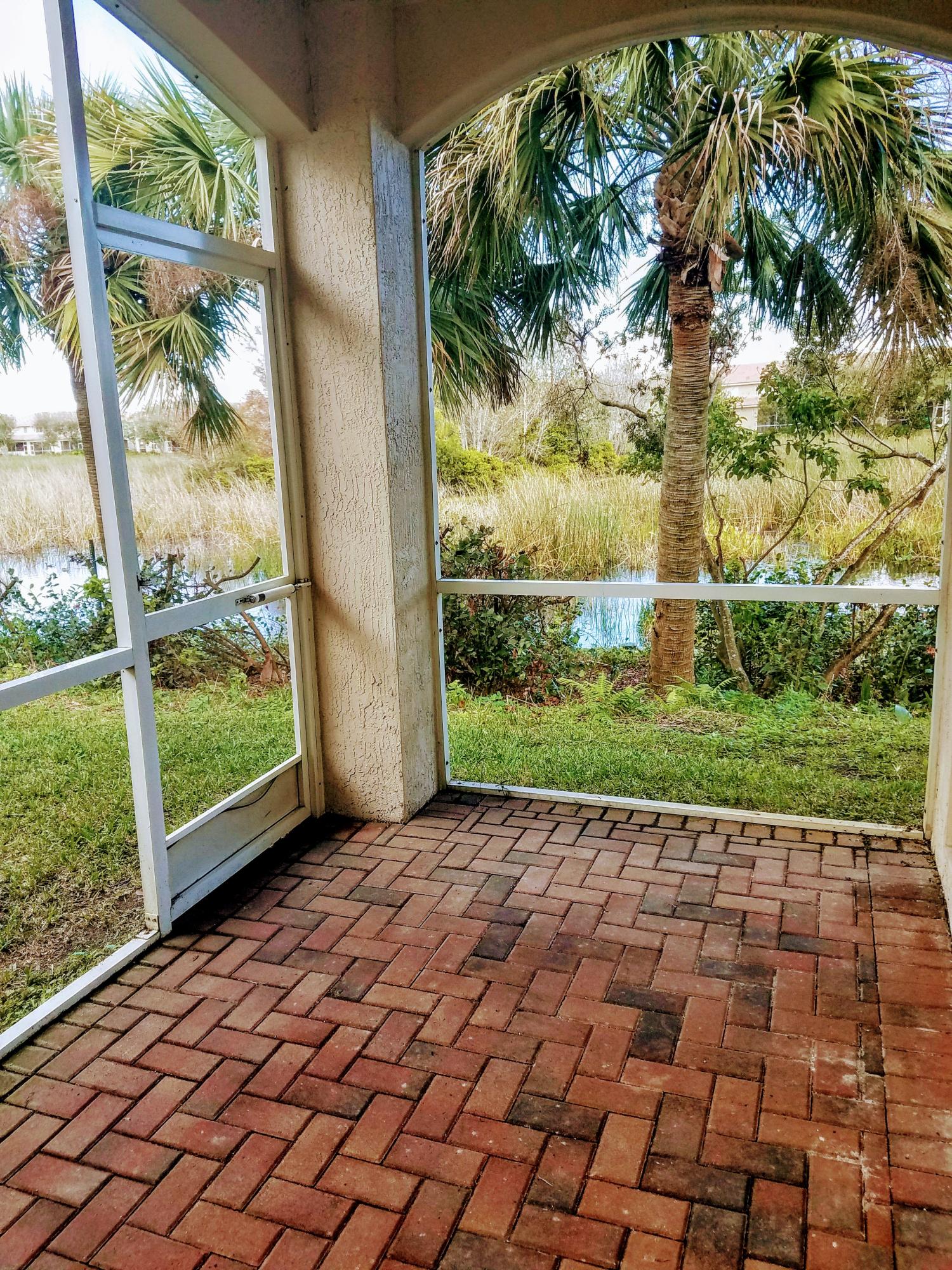 2011 Oakhurst Way Riviera Beach, FL 33404 - Photo 3 of 31 Screened patio