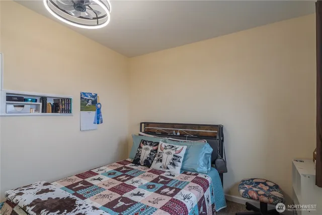 a view of an entryway with a table and chair