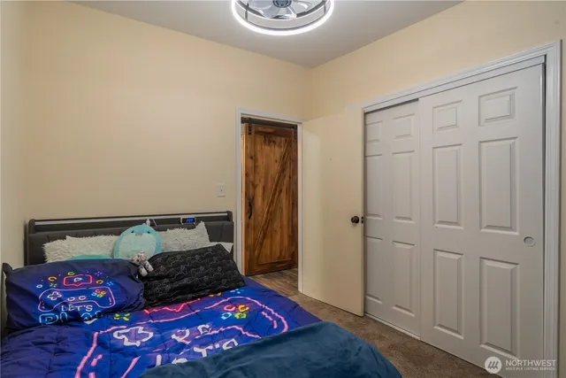 a bedroom with a bed and a cabinets