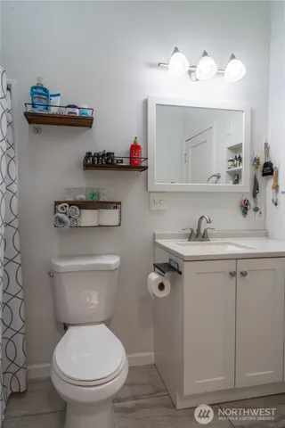 a bedroom with bed and a window