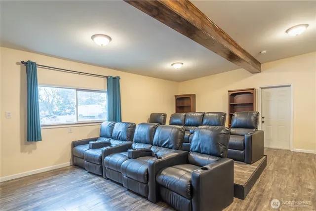 a view of a house with swimming pool and sitting area