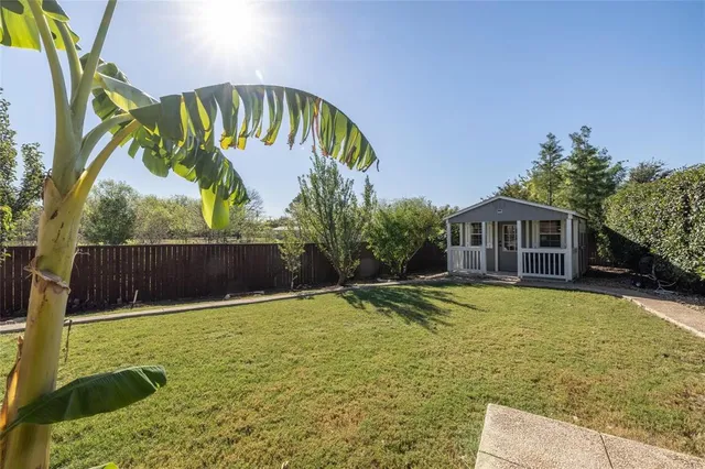 a swimming pool with some trees in the background