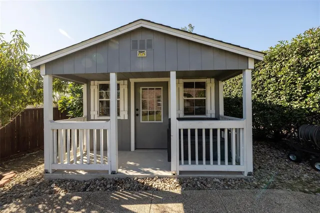 a view of a house with a small yard
