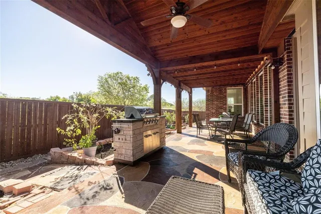 a living room with patio furniture and a wooden floor
