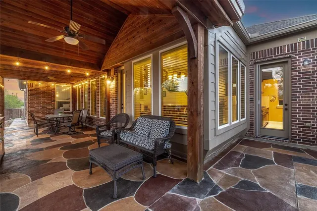 a outdoor space with lots of furniture and glass windows