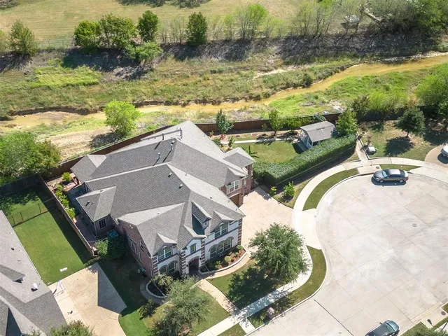 an aerial view of a house with outdoor space