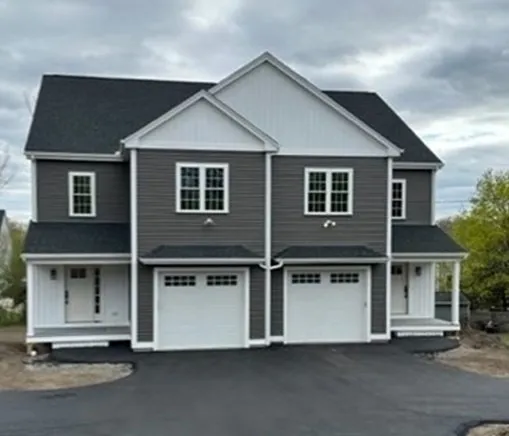 a front view of a house with a garage