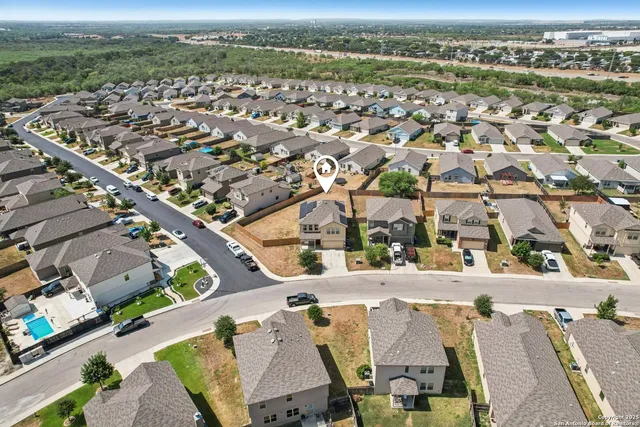an aerial view of a city with lots of residential buildings