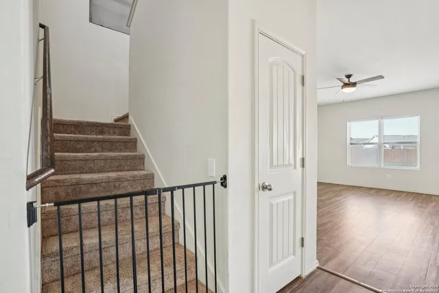 a view of a hallway with staircase