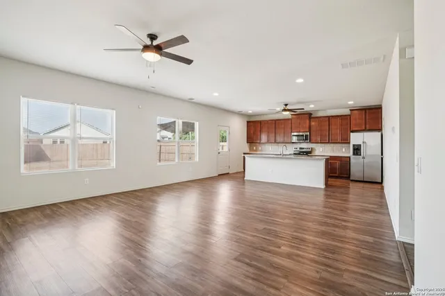 a view of kitchen with wooden floor and window