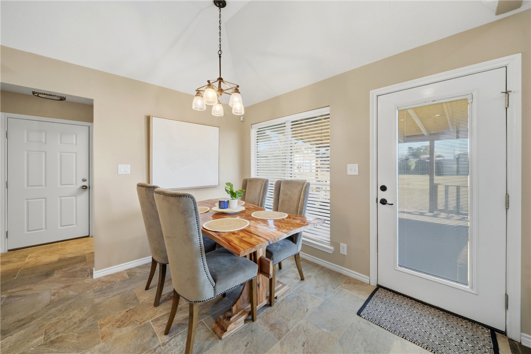 214 Apache Drive Franklin, TX 77856 - Photo 14 of 32 a view of a dining room with furniture window and wooden floor