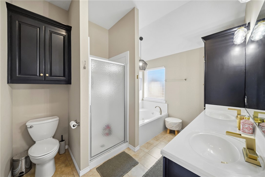 214 Apache Drive Franklin, TX 77856 - Photo 17 of 32 a bathroom with a sink toilet and shower