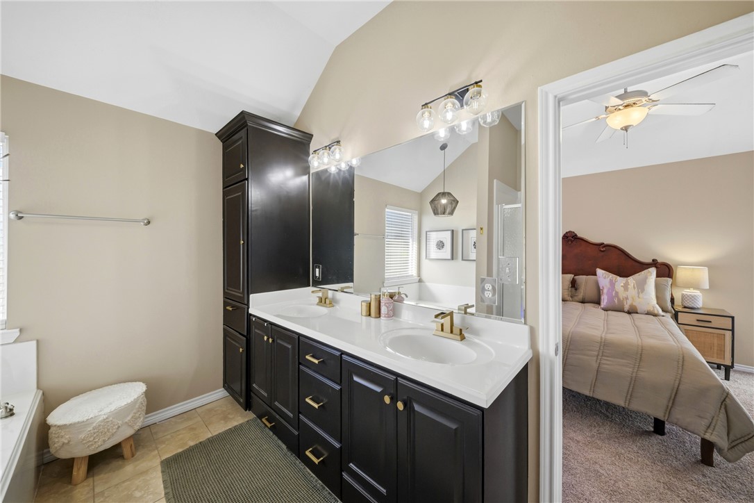 214 Apache Drive Franklin, TX 77856 - Photo 18 of 32 a bathroom with a toilet sink and mirror