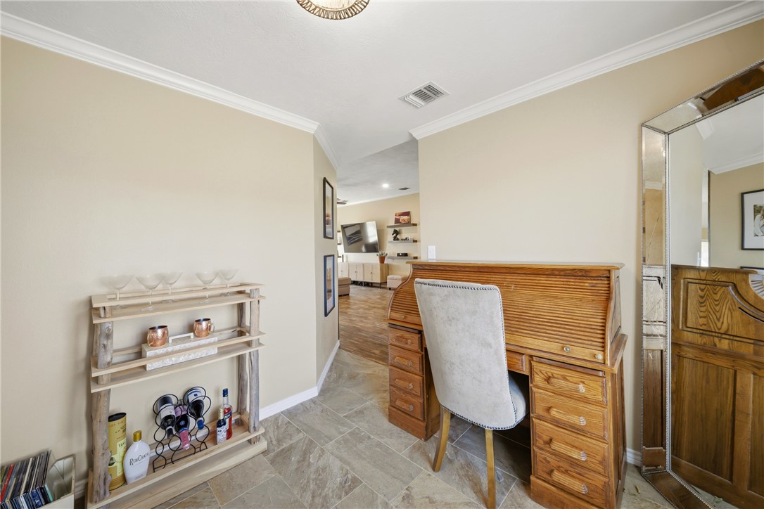 214 Apache Drive Franklin, TX 77856 - Photo 21 of 32 a view of a kitchen with fridge and workspace
